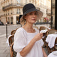 Cappello da donna con fiocco e tesa larga per proteggersi dal sole