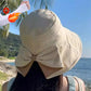 Cappello da donna con fiocco e tesa larga per proteggersi dal sole
