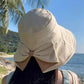 Cappello da donna con fiocco e tesa larga per proteggersi dal sole